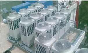 Rooftop condensing units and refrigerant pipework on a completed project